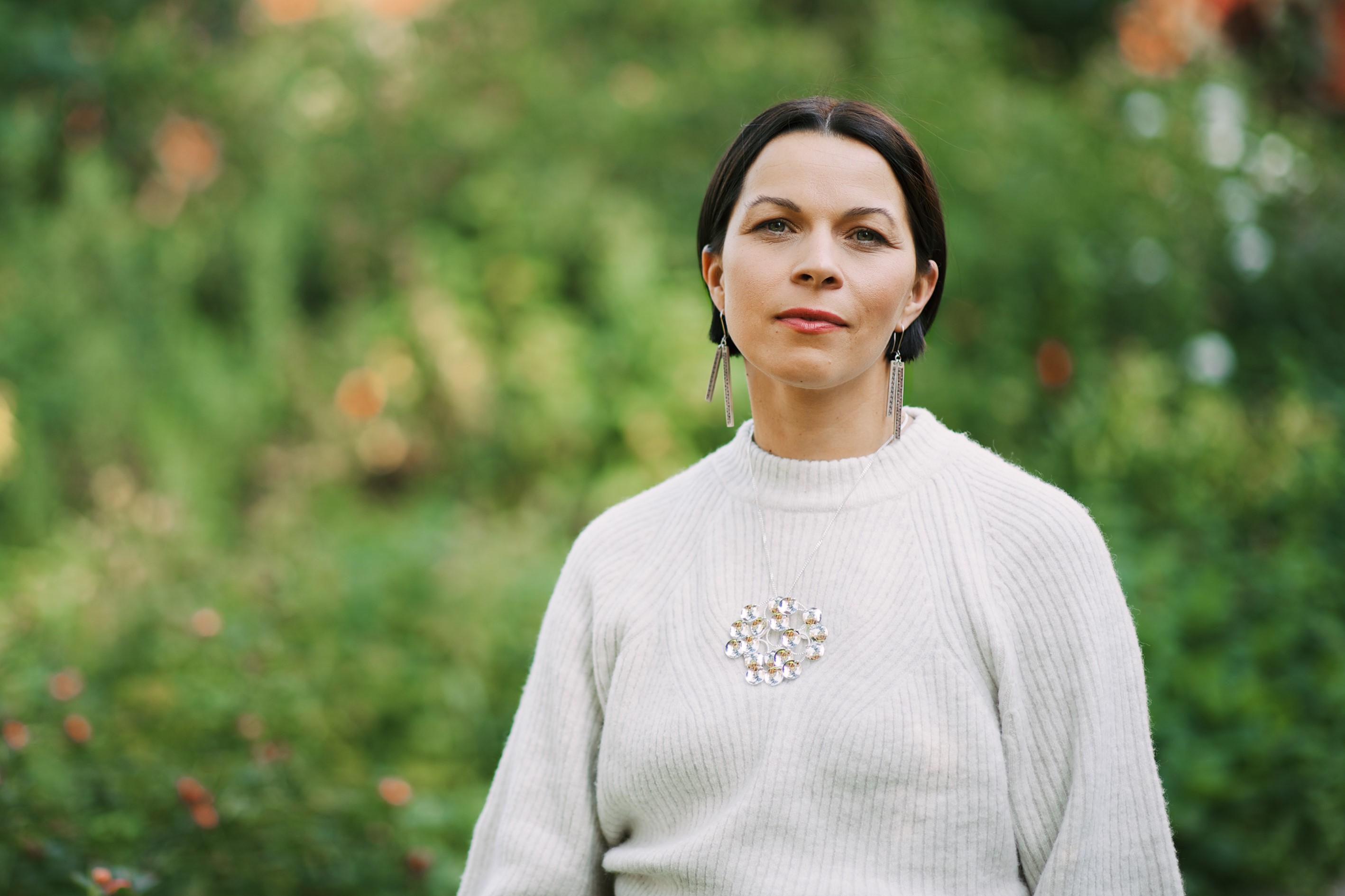 Elin Anna Labba in white top with grassy background