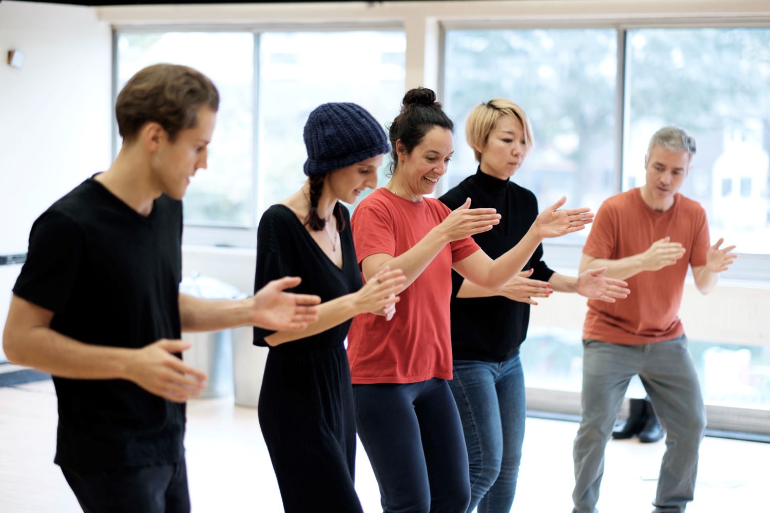 Five people taking part in a dynamic translation workshop