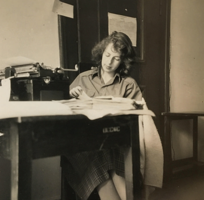 Black and white image of Patricia Crampton reading