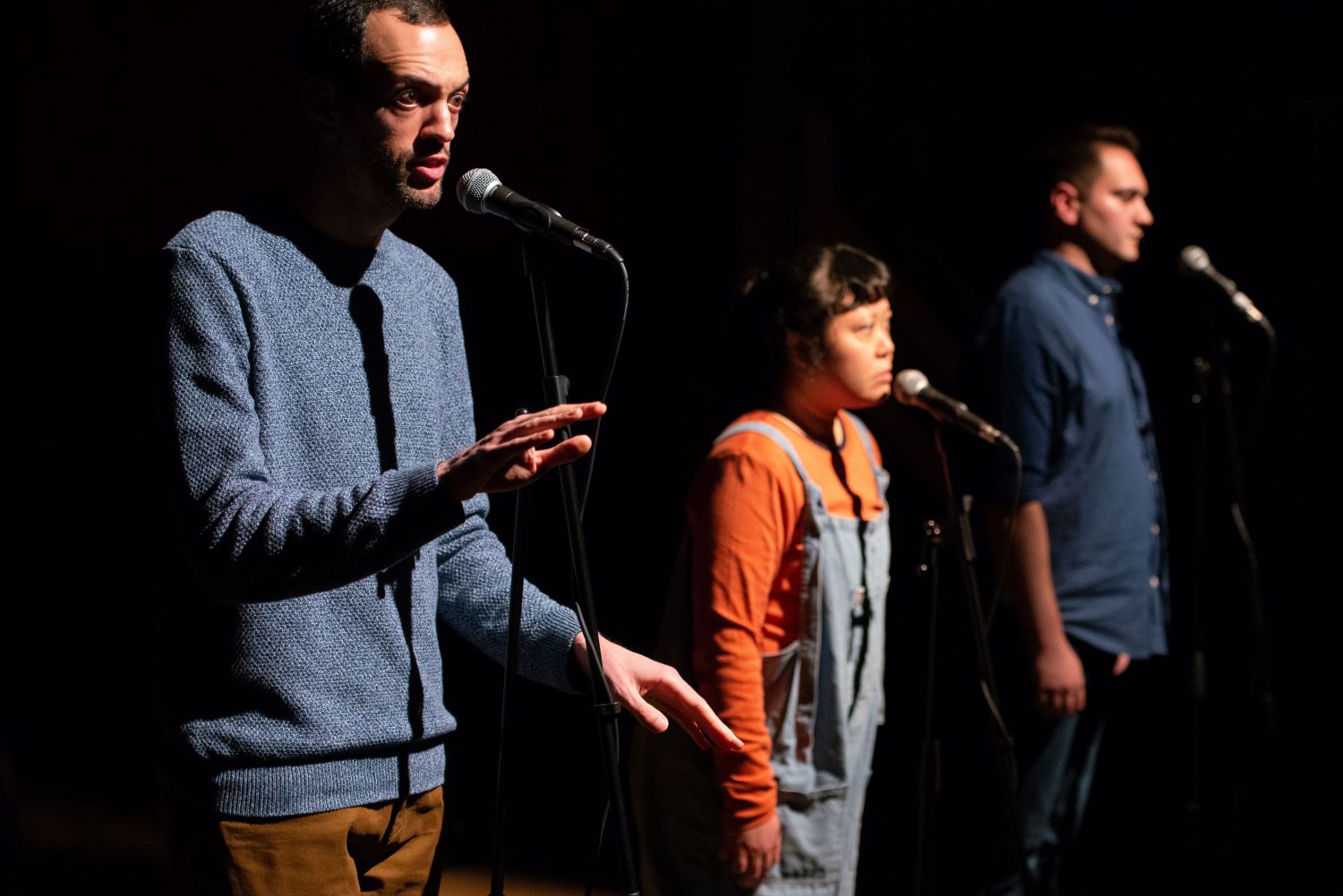 Three actors on stage in Foreign Affairs' production of The Wetsuitman