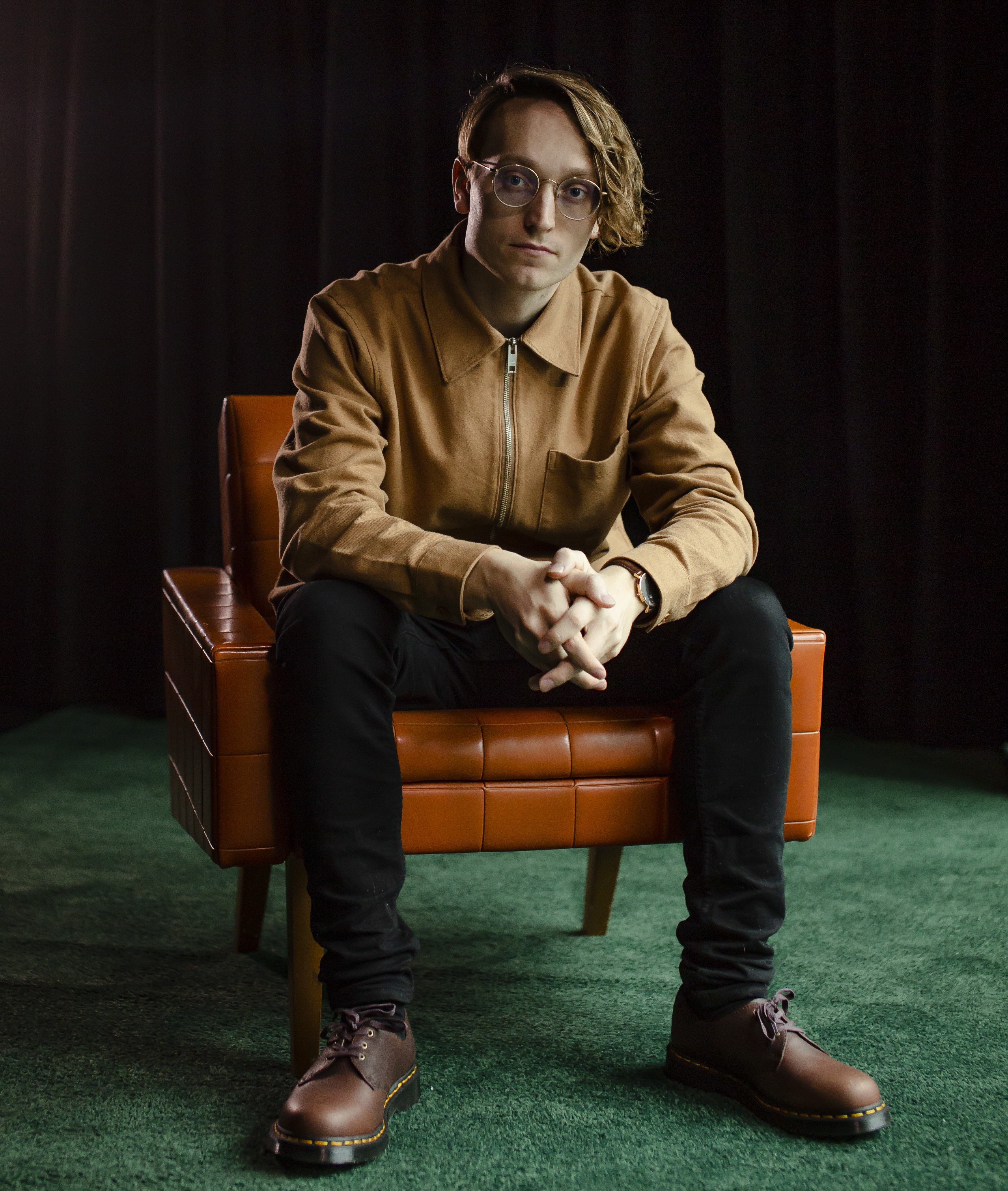 Axel Åhman in orange chair