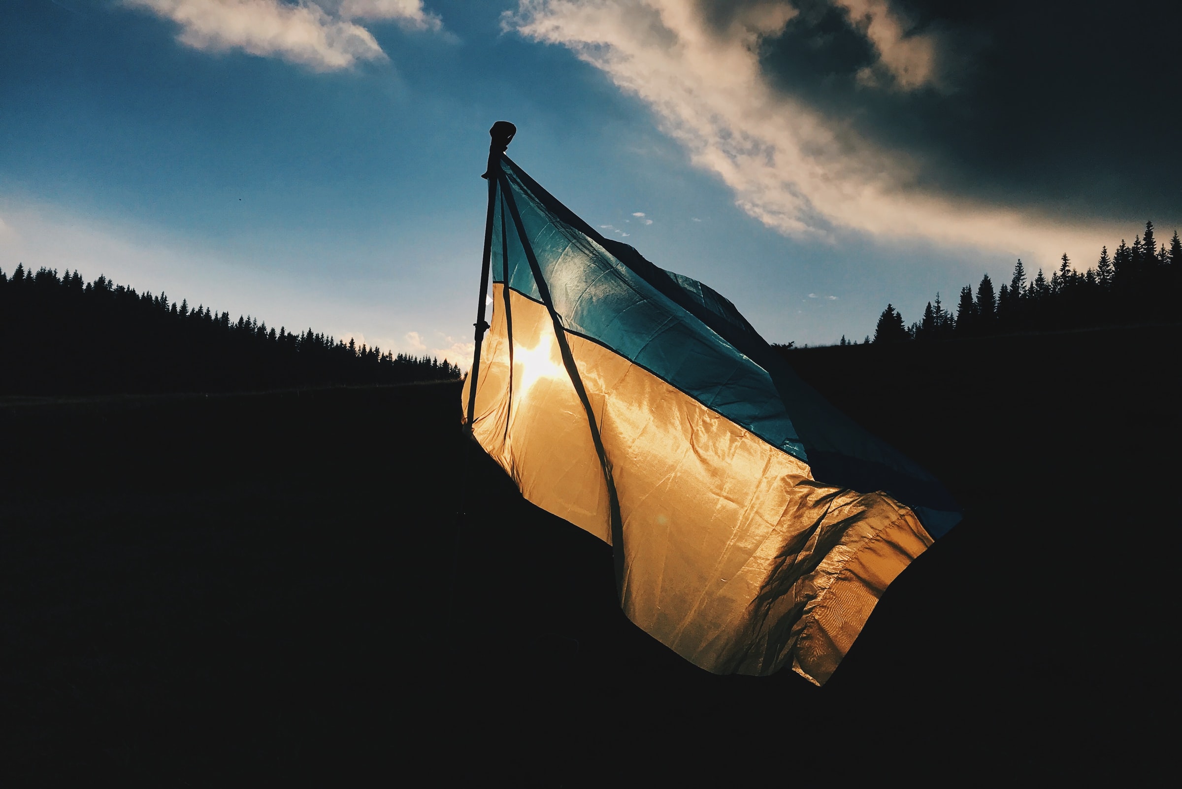Ukrainian flag against dark background