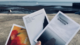 Three Nordisk books, with beach in the background