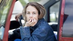 Annika Norlin leaning out of car door.