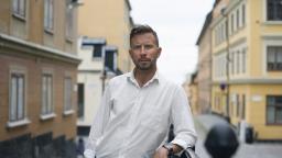 Jonas Malmborg stands on cobbled street.