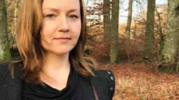 Lida Starodubtseva standing in forest