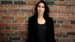 Fatima Bremmer standing in front of brick wall