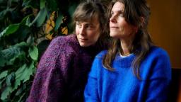 Kristina Sigunsdotter and Jenny Lucander sitting beside each other looking away from camera.