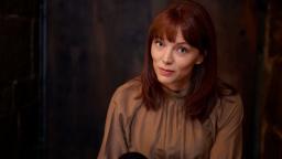 Lina Wolff in brown shirt