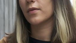 Isabel Cruz Liljegren in front of wooden wall