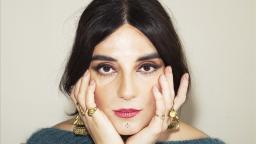 Author photo of Balsam Karam with hands on her face