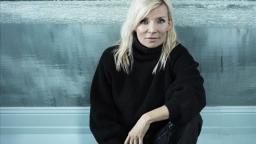 Bea Uusma sitting in front of icy landscape.