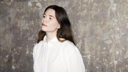 Johanna Hedman standing in front of concrete wall