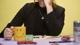 Author photo of Olivia Skoglund with chin resting on her hand.